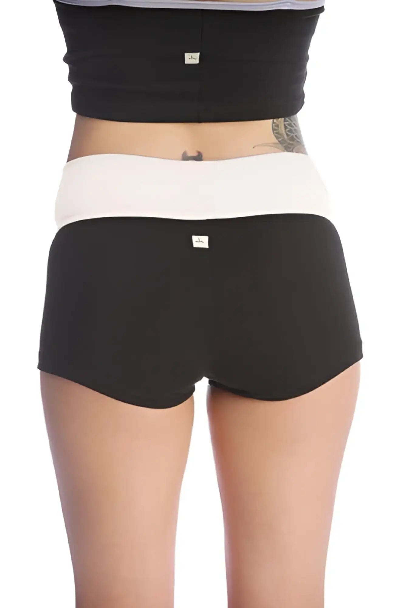 Womens yoga transition short in black and white two tone with high waisted snug fit for comfortable workouts