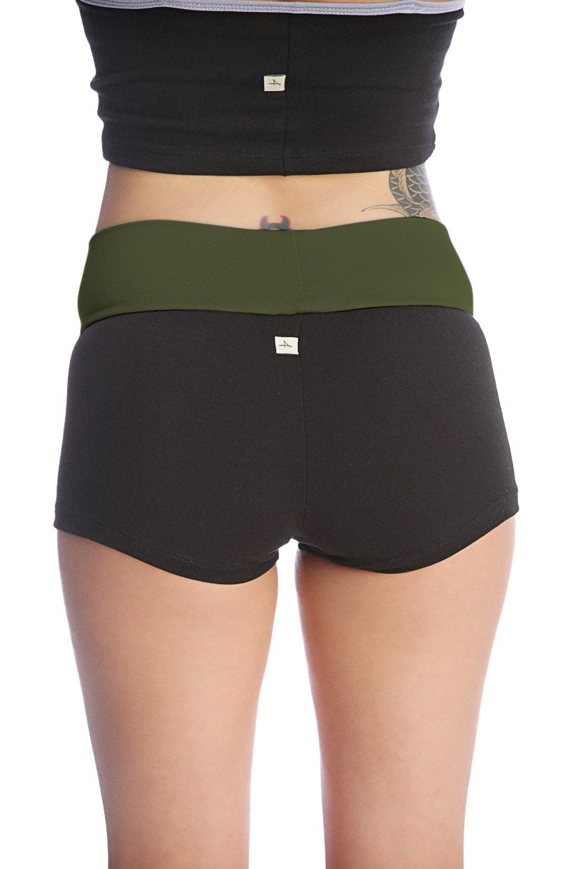 Womens yoga transition short in black with olive green waistband made of soft stretchy fabric with subtle branding