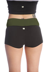 Womens yoga transition short in black with olive green waistband made of soft stretchy fabric with subtle branding