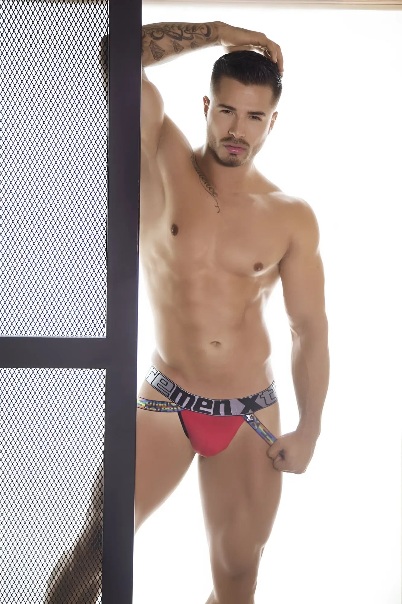 Red and black microfiber pride jockstrap with bold homemen x logo on waistband xtremen 91084