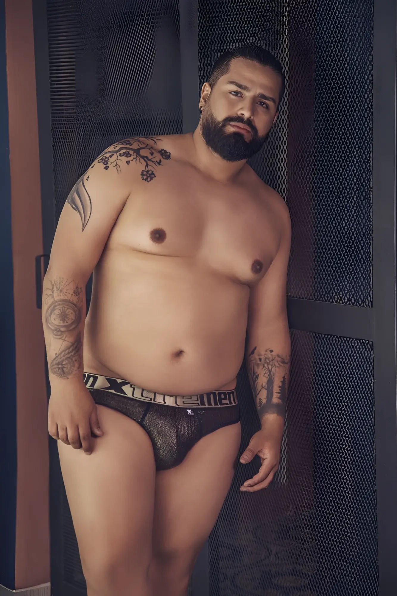 Black lace men’s microfiber thong with white and gray xtremen branded waistband in front view