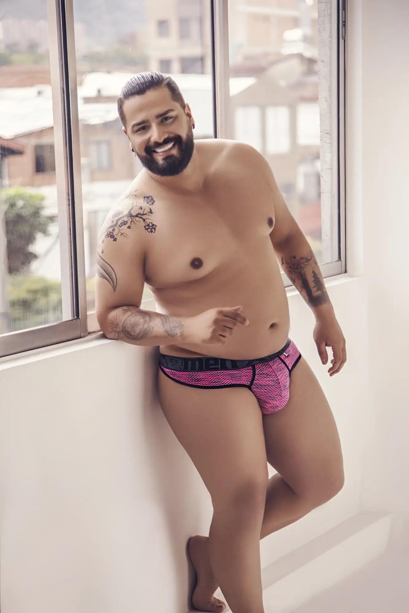 Pink patterned briefs with black trim made of microfiber mesh from xtremen 91100x for comfortable wear