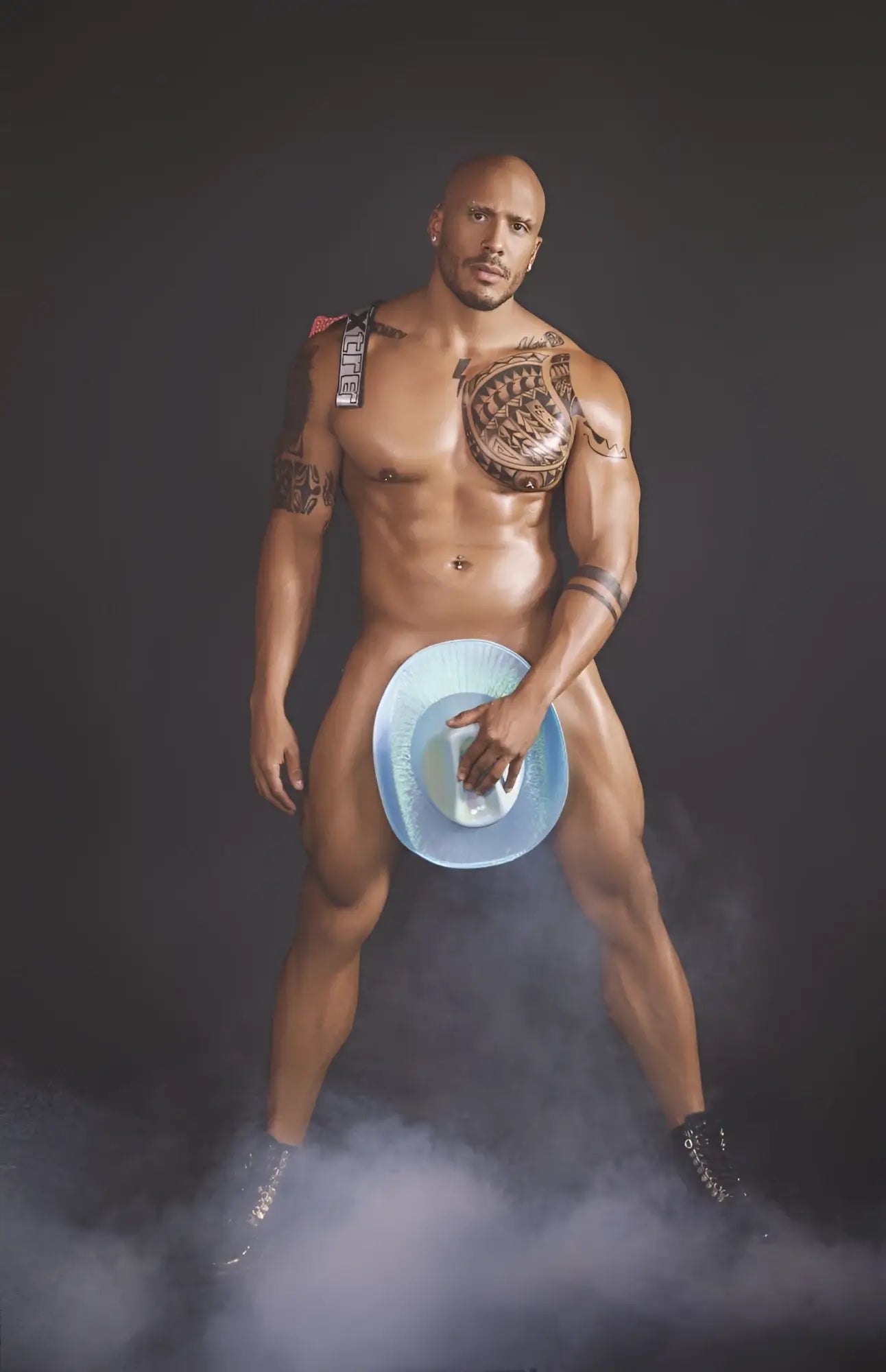 Muscular man holding blue cowboy hat with white interior featuring xtremen 91128 red snake print jockstrap