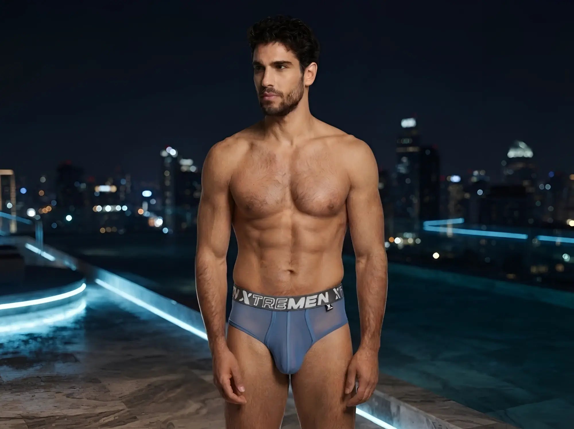 Blue mesh bikini underwear by Xtremen featuring a grey logo waistband and a contoured pouch design.