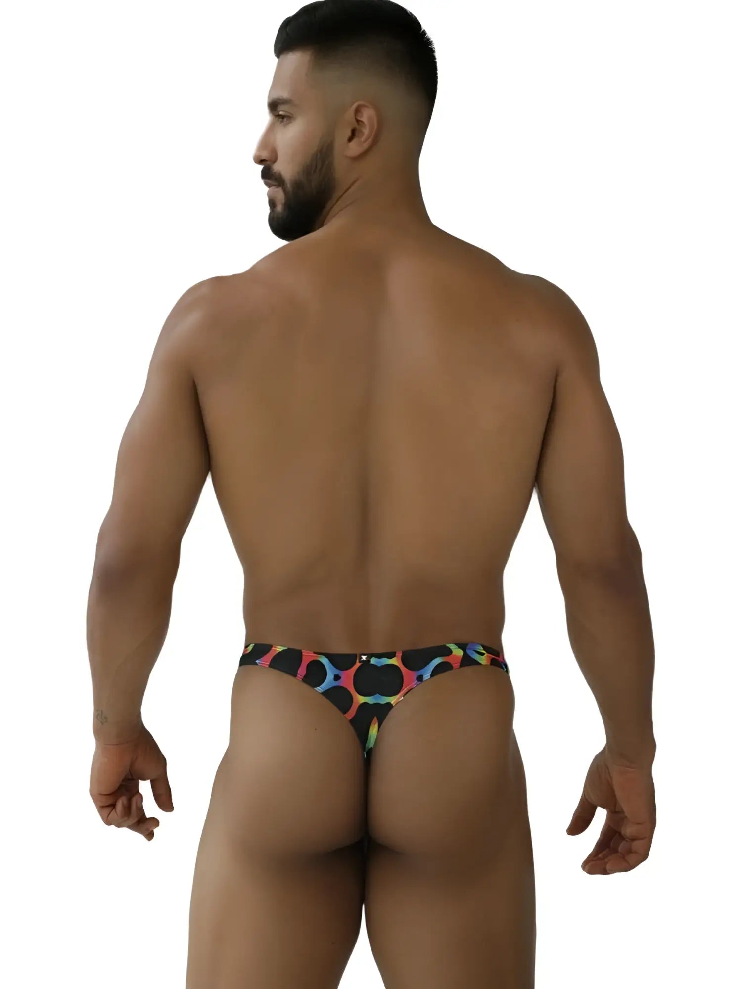 A vibrant rainbow printed microfiber thong with black base and bold circular designs from Xtremen 91284 mushroom color