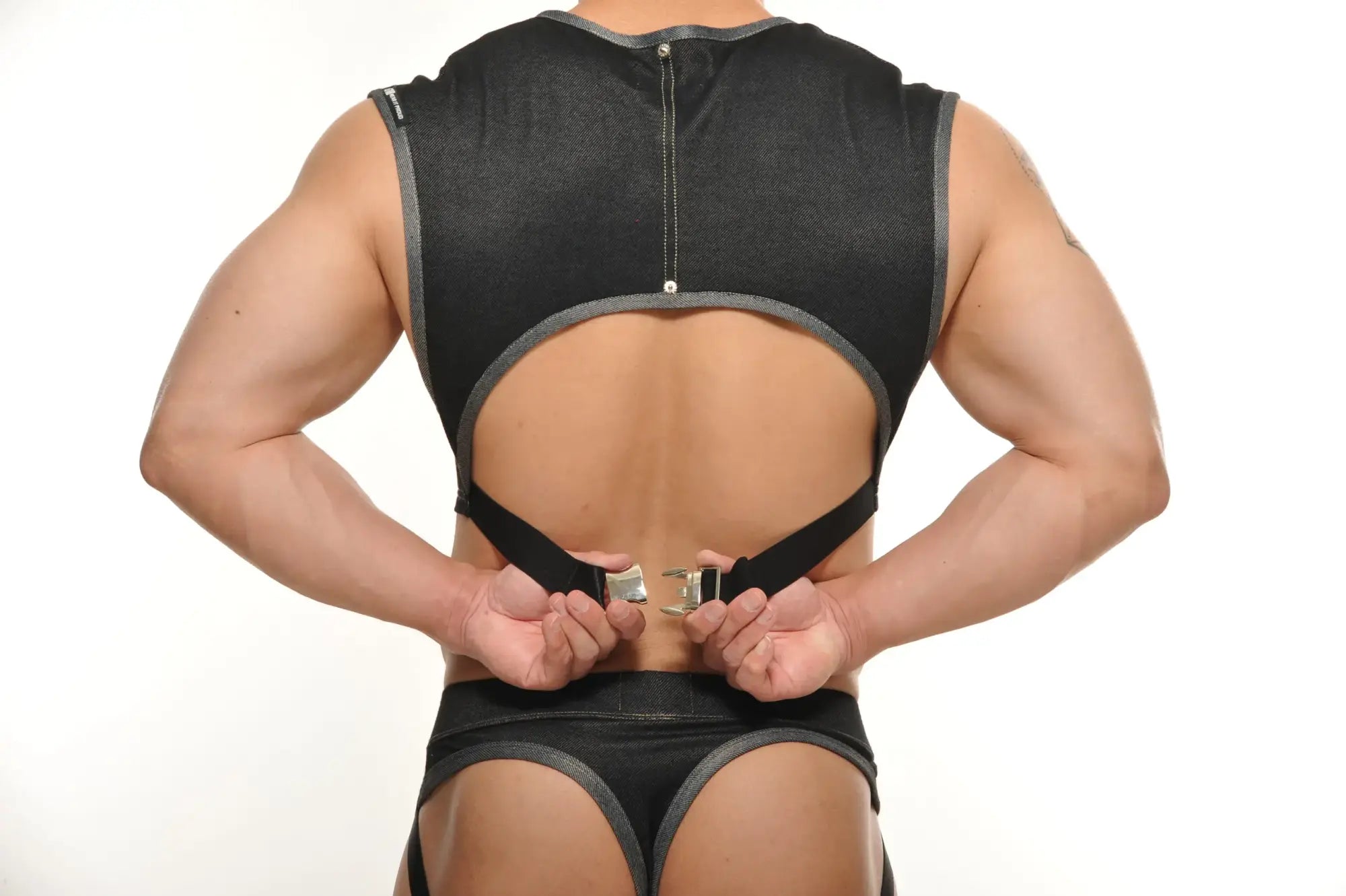 Black mesh backless Yannick muscle top with gray trim and adjustable straps for athletic wear back view