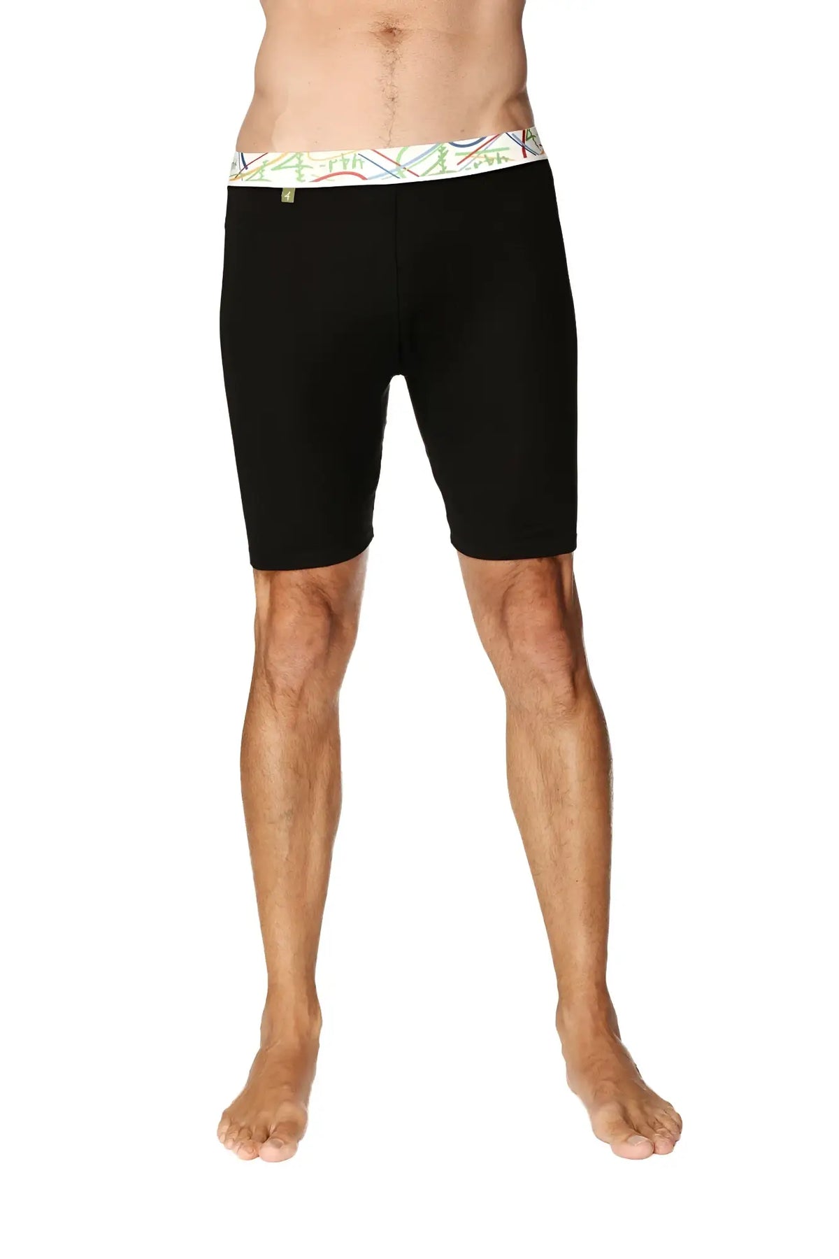 Black yoga compression shorts with colorful geometric patterned waistband designed for men’s cycling and fitness