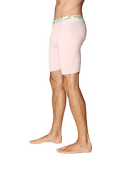 Pink yoga compression shorts with a colorful patterned waistband designed for athletic performance and comfort