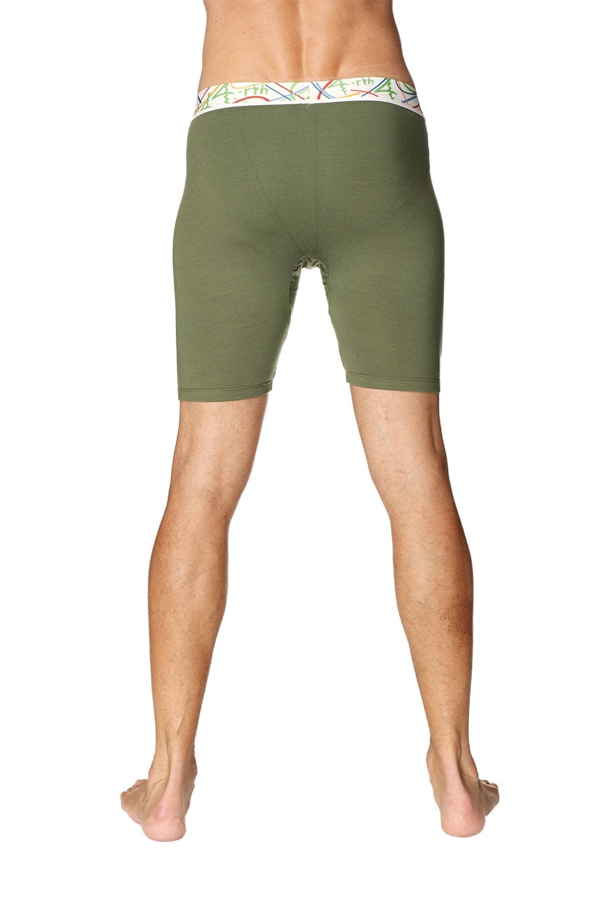Yoga compression shorts in rainforest green with olive green fabric and a colorful patterned waistband for men