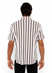 A man wearing a zigzag stripe open stretch knit shirt with white black and gray vertical chain-like patterns