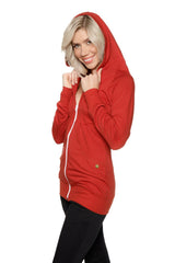A vibrant cinnabar red zip-up long body travel hoodie jacket with a white zipper and subtle gold logo on the lower left side