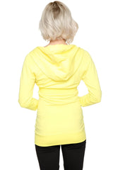 A vibrant yellow zip-up long body travel hoodie jacket with relaxed fit and drawstring hood for comfortable travel